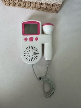 White and Pink Handheld Fetal Doppler - Portable Prenatal Heartbeat Monitoring